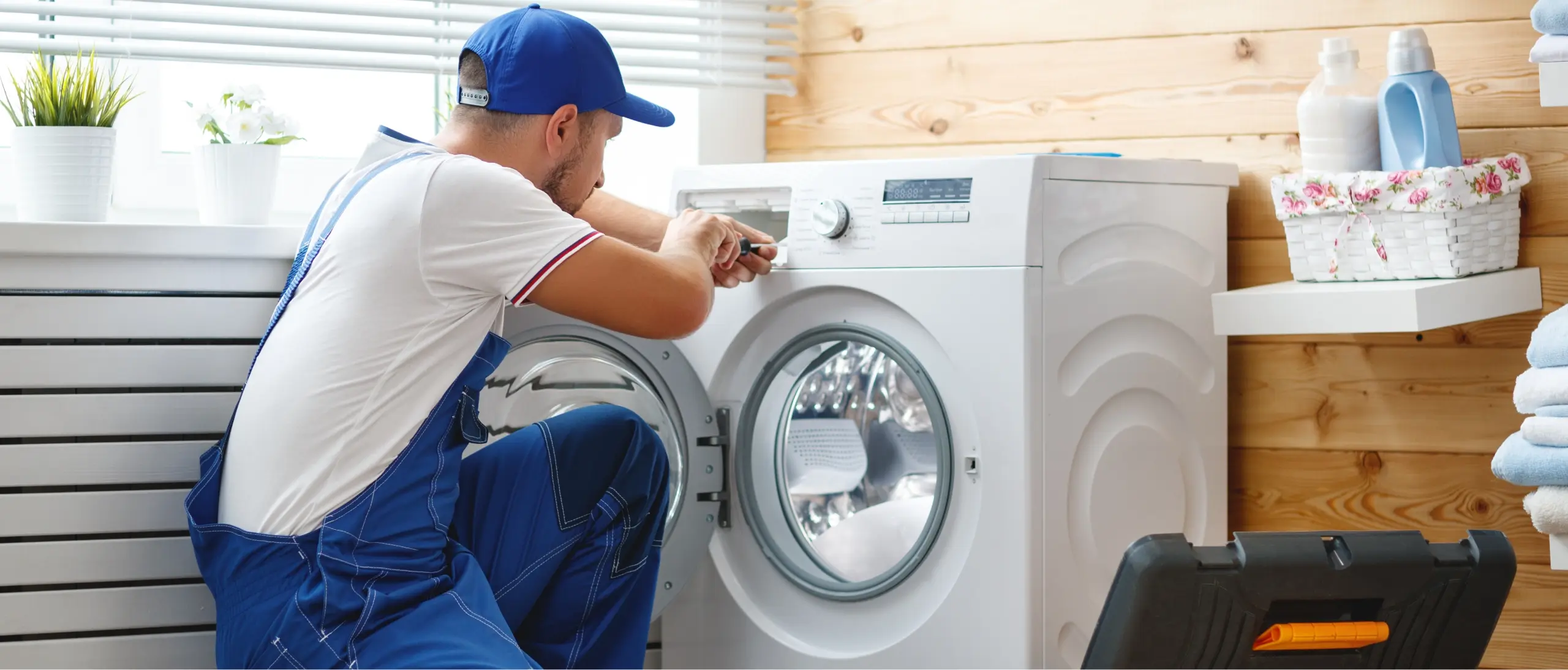 Fair Appliance Repair technician fixing a washing machine