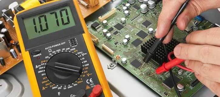 a picture of a circuit board tested with multimeter